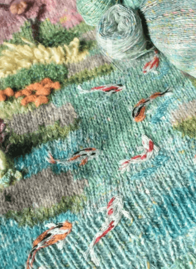 Koi pond stitch detail on handmade Knitwear jersey with yarn cakes — free lookbook on crochet